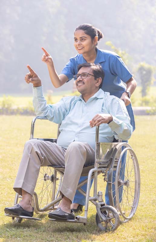 Senior on Wheelchair with Caretaker